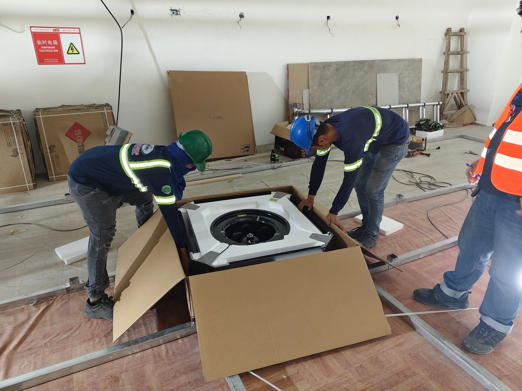GenCool HVAC technician servicing a modern commercial air conditioning system